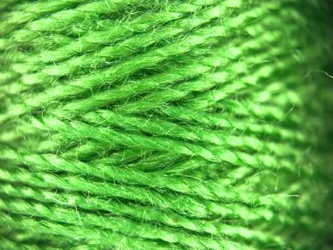 Green yarn thread texture close up macro concept for knitting, textile industry, 库存照片