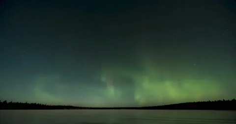 Green, yellow and teal colored Aurora swirling with spikes in a sky filled with  Stock Footage 149980480
