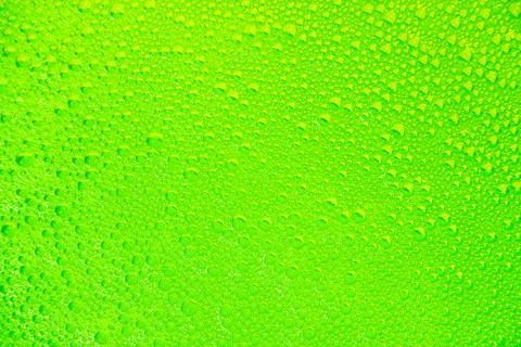 Green yellow soap bubbles as background and texture. Stock Photos