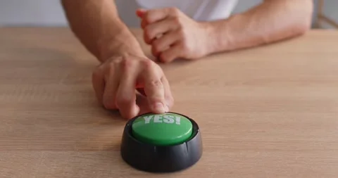 Green YES button on wooden desk with hand pressing for approval decision Stock Footage 320447580