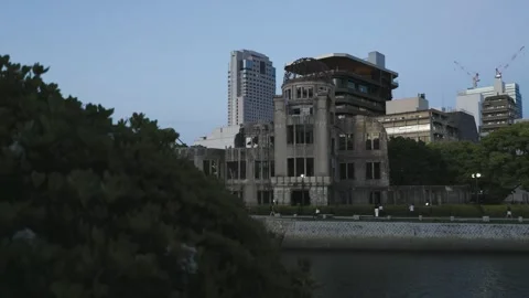 Greenery in foreground, atomic b dome and other buildings in background Video stock 340275154