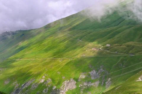 Greenery mountain under clouds Stock-Fotos