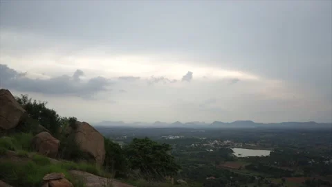 Greenery, rocks and running clouds over Karnataka, India, countryside TIMELAPSE Stock Footage 164615786