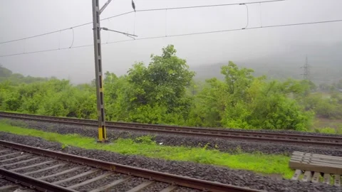 Greenery view on rain from train window Stock Footage 247257386