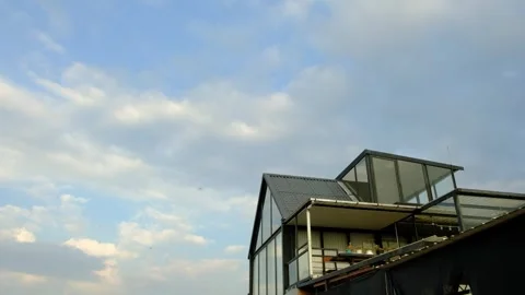 Greenhouse with Cloudy Sky 動画素材 243616390