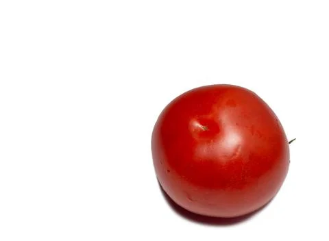 Greenhouse tomato on a white background. Ripe vegetable. Tomato isolate. Vege Stock Photos