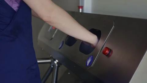 Greenhouse worker using hand scanner for access control Stockbeeldmateriaal 313598819