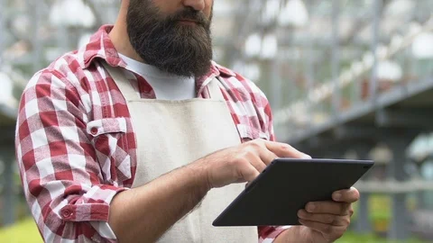 Greenhouse worker working tablet application, online business control technology Stock-Footage 118909452
