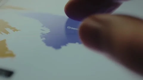 Greenland on the blue digital map, user interacts with the map Stock Footage 328379477