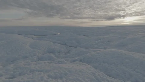 Greenland Ice Sheet and Cloudy Skies at Sunset Aerial Stock Footage 292941400