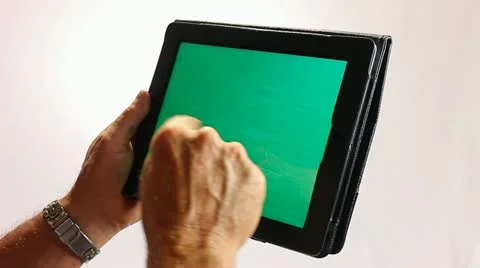 GREENSCREEN HANDS WORKING ON A TABLET COMPUTER 2 Stock Footage 12159561