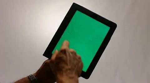 GREENSCREEN HANDS WORKING ON A TABLET COMPUTER Stock Footage 12159619