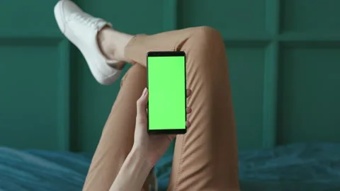 Greenscreen Mock-up for Tracking or Watching Advertising Video Content or News B Video stock 199477041