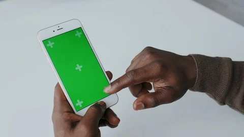 Greenscreen or Mock-up Tracking in African American Male Hands with Blank Stock Footage 120679390