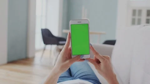Greenscreen for Tracking or Mock-up Replace. Girl Using Modern Mobile gadget Stock Footage 122415767
