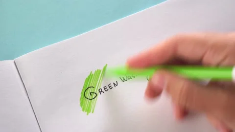 Greenwashing concept. Drawing on paper with text and green marker strokes Stock Footage 160296152