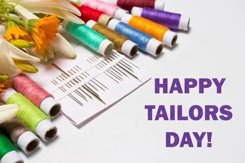 Greeting card with multi-colored threads and the text Happy Tailors Day. For the Stock Photos