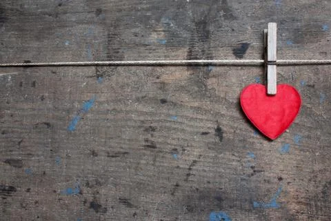 Greeting card with red heart on wooden surface Stock Photos
