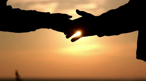 Greeting hands at dawn(close-up) Stock-Footage 32421266