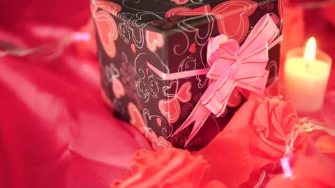 Greeting Valentine day with gift boxes, candle burning and flower rose footage Video stock 101222156