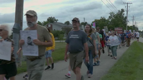 "Greg Bovino's got to go!" chants at pro-immigrant protest in Fishers, Indiana Stock Footage 341357654