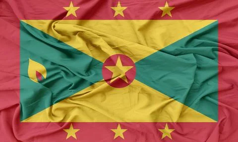 Grenada  Flag fabric moving in the slow breeze Stock Photos