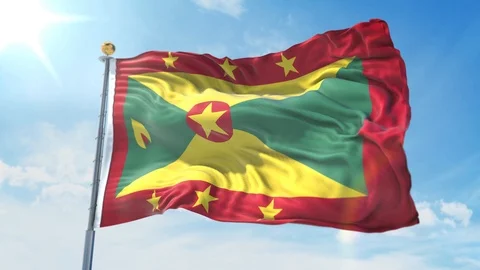 Grenada flag waving in the wind against deep blue sky. National theme. Stock Footage 123982991