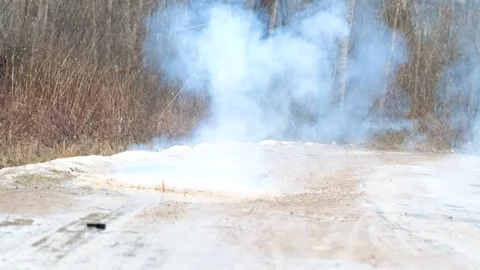 Grenade explodes on dirty road Stock Footage 150556325