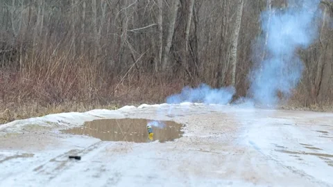 Grenade explodes on dirty road Stock Footage 150557285