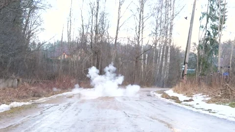 Grenade explodes on dirty road Stock Footage 150557361