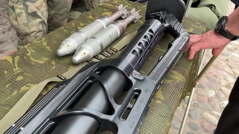 The grenade launcher and shells are on the table. 스톡 동영상 244464517