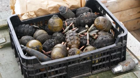 Grenades, shells and bullets in plastic box for disposal Stock Footage 260817990