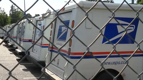 Gresham, Oregon, June 28, 2015 – The USPS logo is prominent on postal trucks in Stock Footage 92075097
