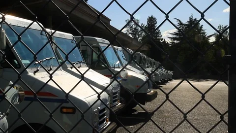 Gresham, Oregon, June 28, 2015 – U.S. Postal Service (USPS) trucks are parked Stock Footage 92075107