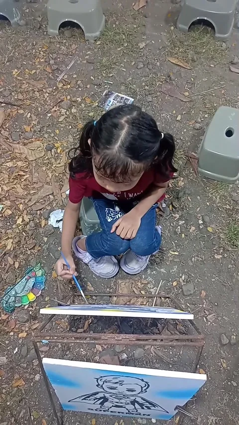 Gresik East Java Indonesia. Child painting on styrofoam. On July 5 2025 Stock Footage 313257882