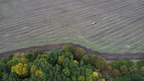 GreTractor working on the field. Environment scene. Stock Footage 213630151