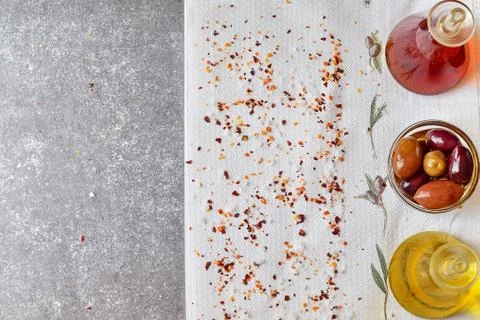 Grey abstract background with space for text. Olive oil jar, wine vinegar jar Stock Photos