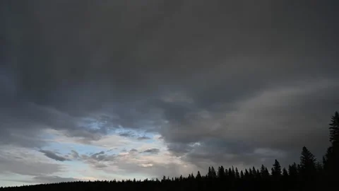 Grey and bluish evening storm clouds moving into the distance  Stock Footage 150069797