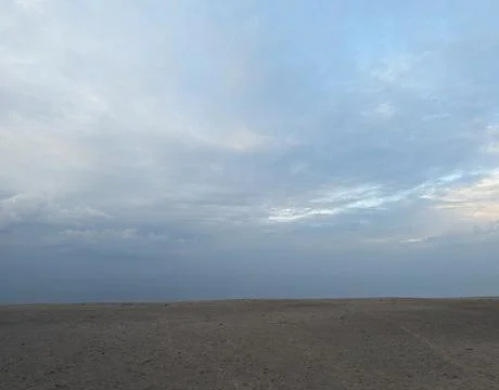 Grey and Cloudy Beach Stock Photos