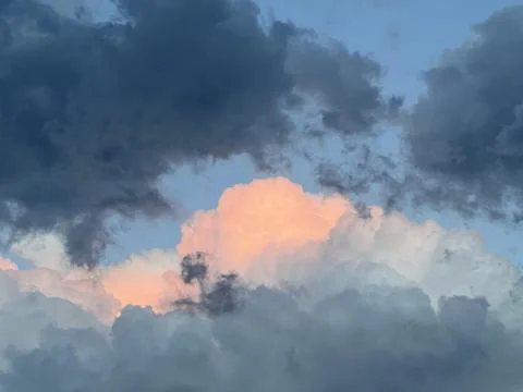 Grey and orange clouds Stock Photos