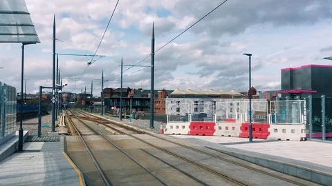 Grey and White Clouds drift over a deserted empty railway station Stock-Footage 79074366