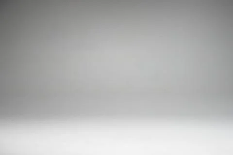 Grey and white gradient in studio wall for copyspace background Stock Photos
