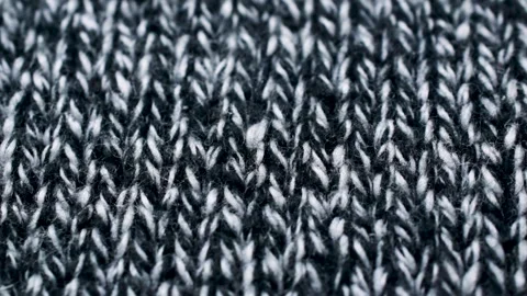 Grey and white threads in knitted fabric texture. Closeup detailed sweater Stock Footage 208698828