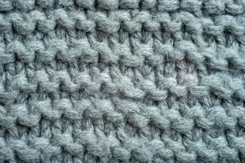 Grey background of knitted thread pattern Stock Photos