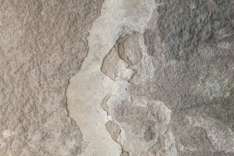 Grey background, old chipped plaster on the concrete wall, texture Stock Photos