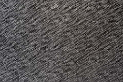 Grey background from a textile material with wicker pattern, closeup. Stock Photos