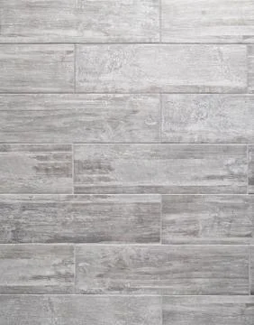 Grey bathroom wall made with rectangular ceramic tiles Stock Photos