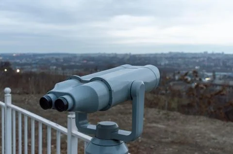 Grey binoculars at the observation deck on a cloudy day Stock Photos