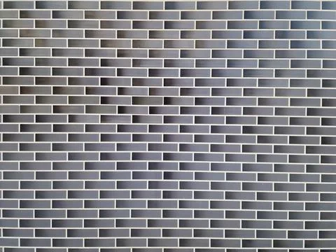 Grey black brick wall texture background Stock Photos