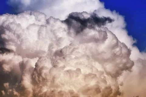 Grey black cloud in a blue sky big storm cloud in a blue sky ,model releas... Stock Photos